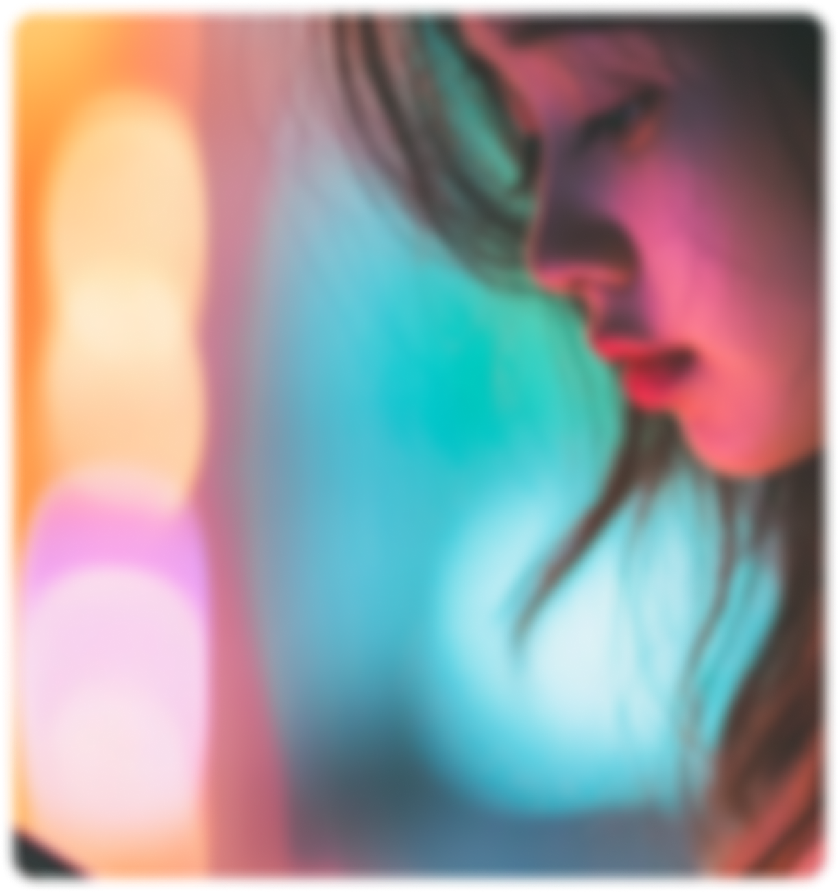 Soft‑focus side profile of a woman lit by teal and pink neon lights, abstract bokeh in background